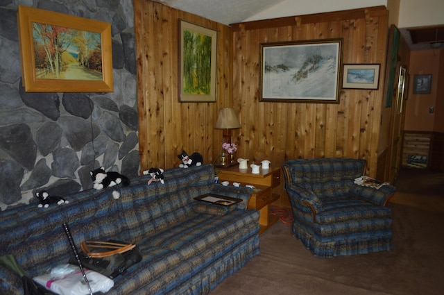 sitting room featuring carpet floors, wooden walls, and vaulted ceiling