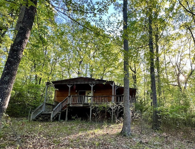 view of front of property featuring stairway