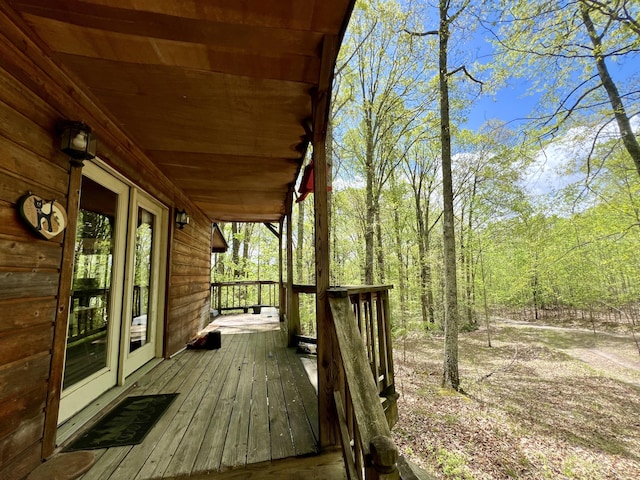 wooden terrace with a porch