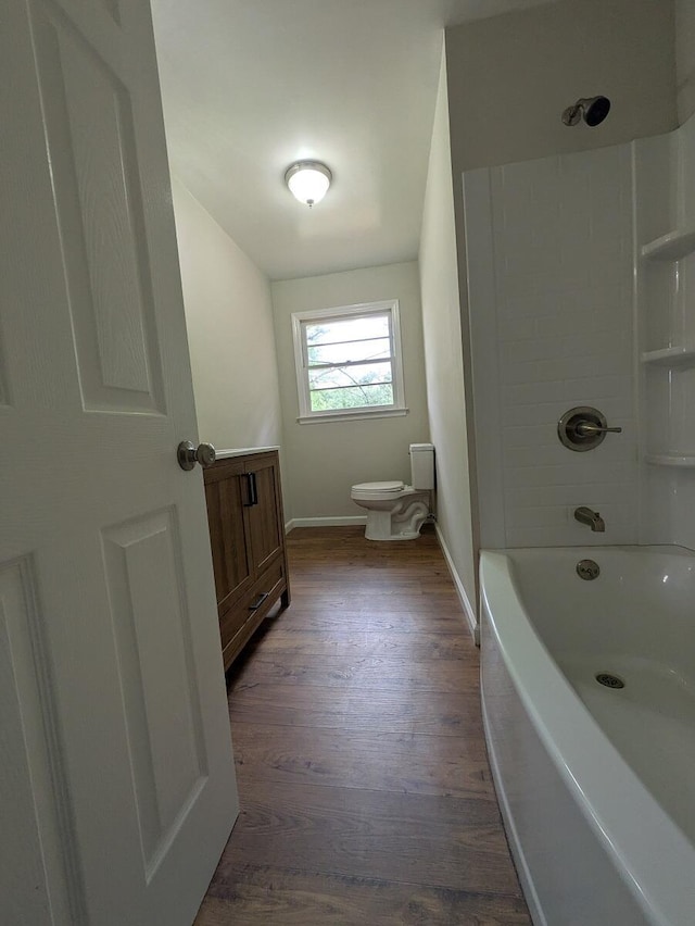58 Lakeland Cir, Troutville, VA 24175 - bathroom featuring toilet, wood finished floors, washtub / shower combination, baseboards, and vanity