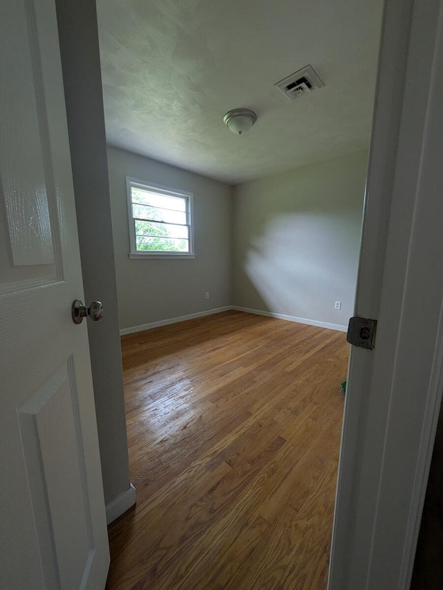 58 Lakeland Cir, Troutville, VA 24175 - unfurnished room featuring baseboards, visible vents, and wood finished floors