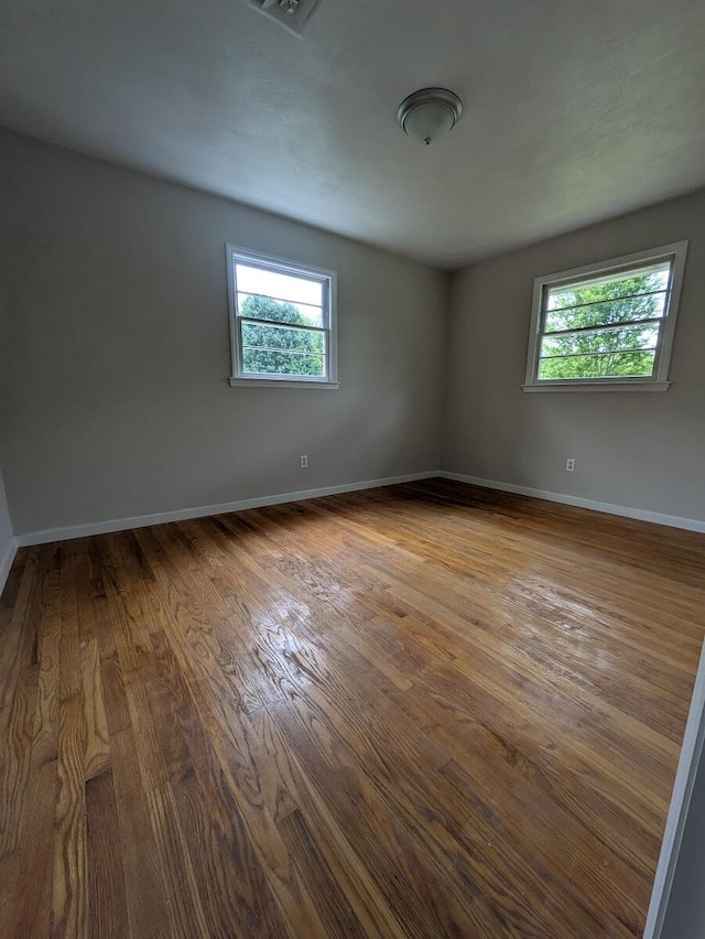 58 Lakeland Cir, Troutville, VA 24175 - empty room featuring baseboards, a healthy amount of sunlight, and wood finished floors