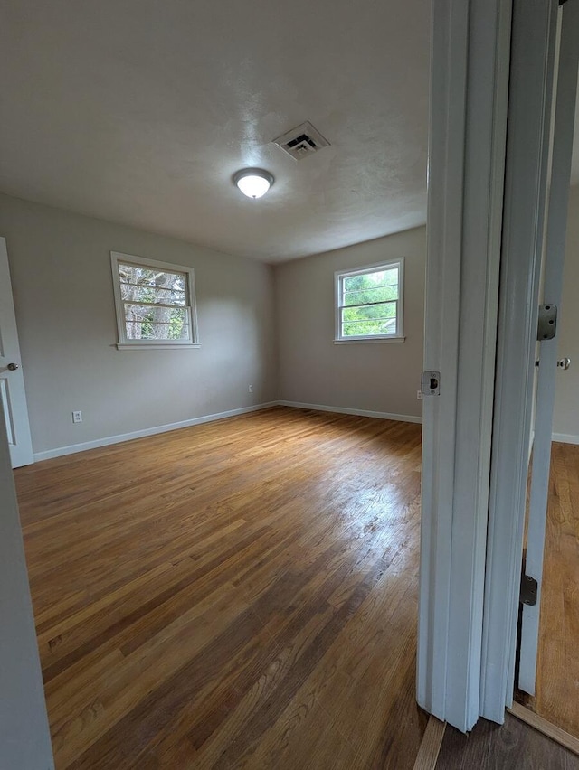 58 Lakeland Cir, Troutville, VA 24175 - spare room with baseboards, visible vents, and wood finished floors