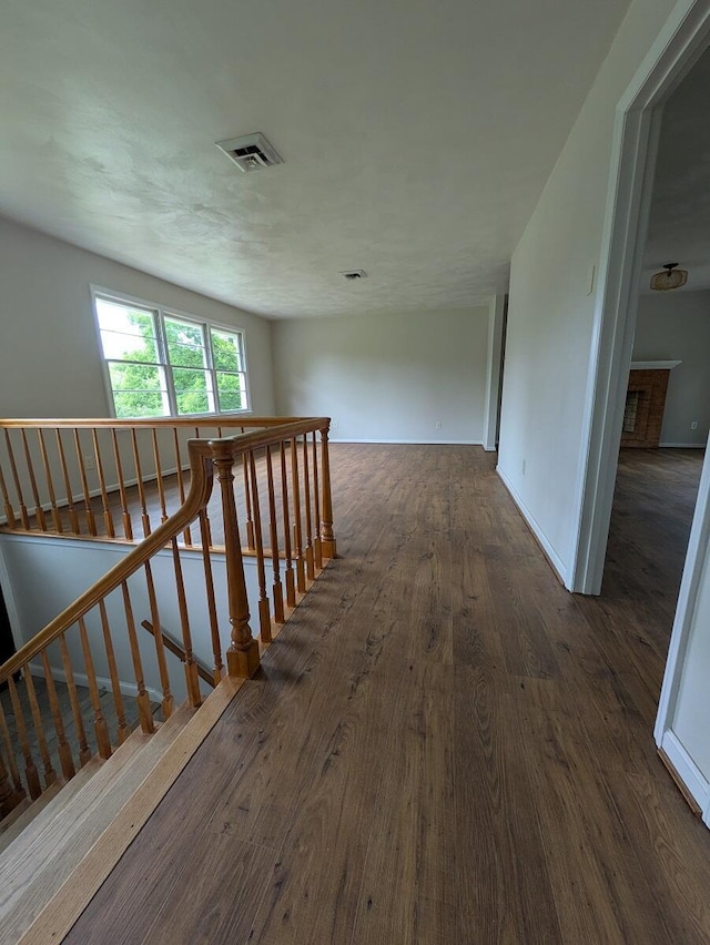 58 Lakeland Cir, Troutville, VA 24175 - hall featuring an upstairs landing, visible vents, and wood finished floors