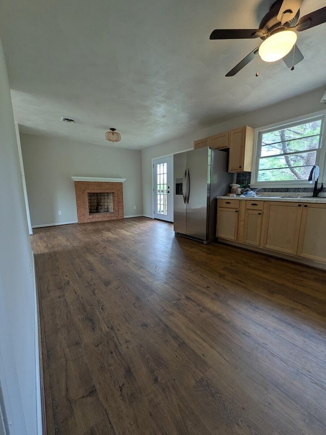58 Lakeland Cir, Troutville, VA 24175 - kitchen with stainless steel fridge, dark wood-style flooring, light brown cabinets, and open floor plan