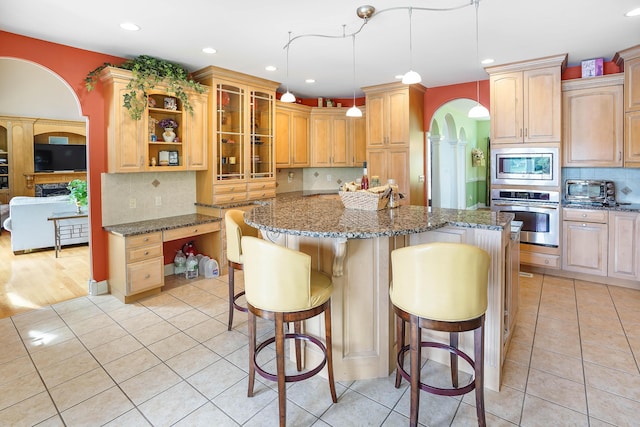 2580 Lakewood Forest Rd, Moneta, VA 24121 - kitchen featuring stainless steel appliances, light tile patterned floors, recessed lighting, stone counters, and a kitchen breakfast bar