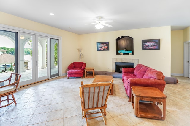 2580 Lakewood Forest Rd, Moneta, VA 24121 - living area featuring light tile patterned flooring, ceiling fan, a tiled fireplace, french doors, and recessed lighting