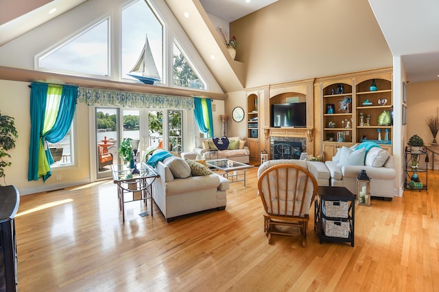 2580 Lakewood Forest Rd, Moneta, VA 24121 - living area with high vaulted ceiling, light wood-style floors, and a fireplace