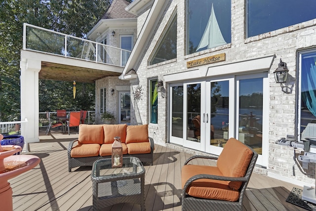 2580 Lakewood Forest Rd, Moneta, VA 24121 - wooden terrace with french doors, outdoor dining space, and an outdoor hangout area