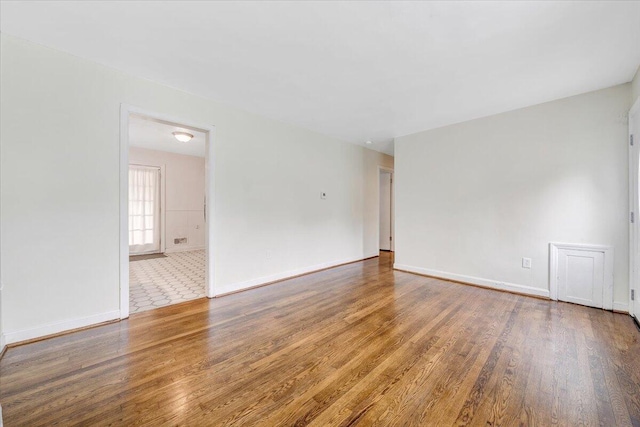 1218 Grayson Ave NW, Roanoke, VA 24017 - spare room featuring wood finished floors and baseboards