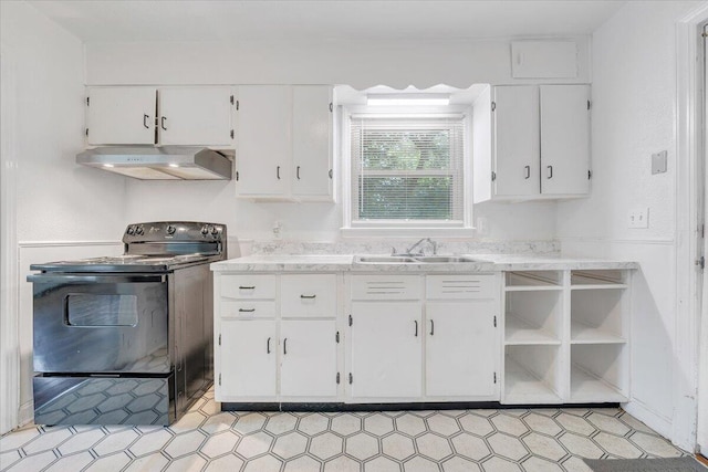 1218 Grayson Ave NW, Roanoke, VA 24017 - kitchen featuring under cabinet range hood, black electric range oven, a sink, white cabinetry, and light stone countertops