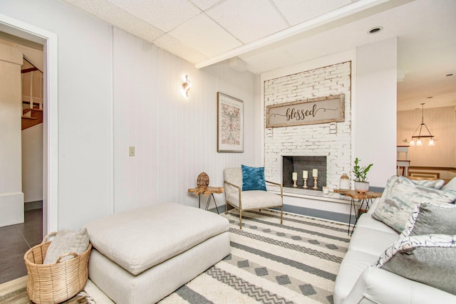 living room with a brick fireplace