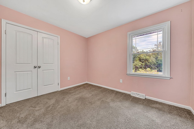 3443 Overhill Trl, Roanoke, VA 24018 - unfurnished bedroom with carpet floors, a closet, and baseboards