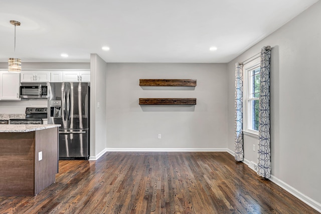 3443 Overhill Trl, Roanoke, VA 24018 - kitchen with appliances with stainless steel finishes, dark wood-style flooring, light stone countertops, white cabinets, and recessed lighting