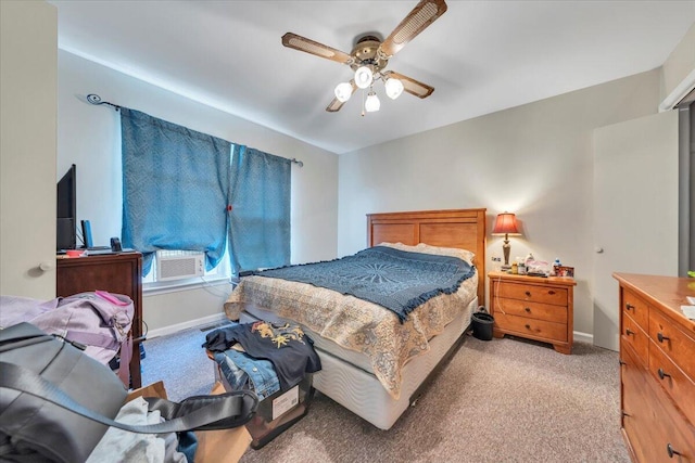 bedroom featuring light carpet, baseboards, and ceiling fan