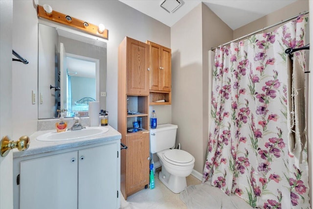 bathroom with toilet, vanity, and a shower with shower curtain
