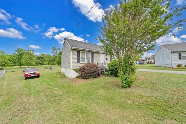view of property exterior with a yard
