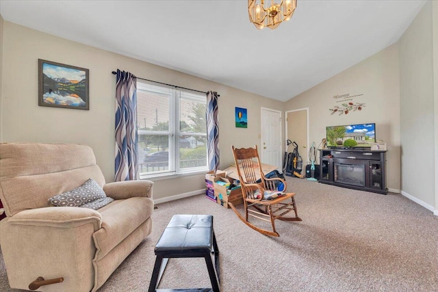 carpeted living room featuring baseboards, a chandelier, and vaulted ceiling