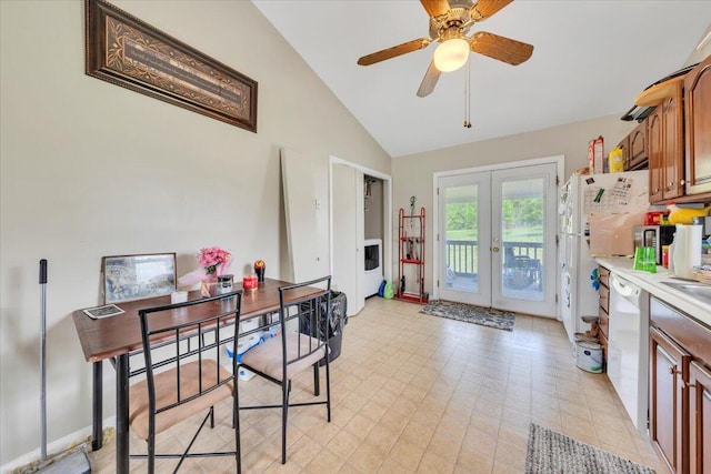 dining area with french doors, a ceiling fan, and high vaulted ceiling