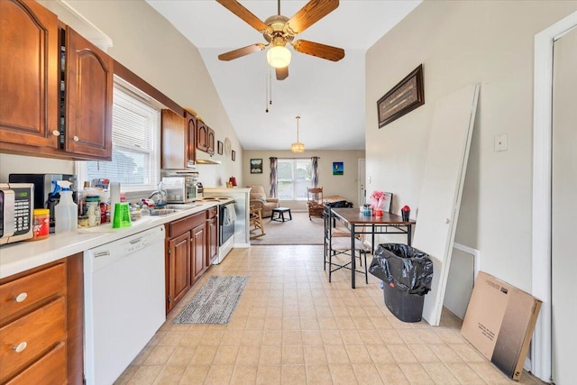 kitchen with white appliances, lofted ceiling, a ceiling fan, light countertops, and light floors