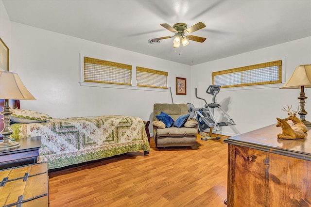 bedroom with wood finished floors and a ceiling fan