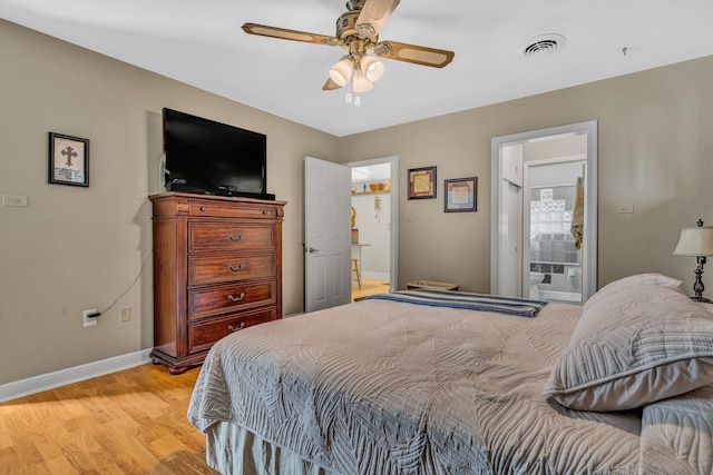 bedroom with light wood finished floors, baseboards, ceiling fan, and ensuite bathroom