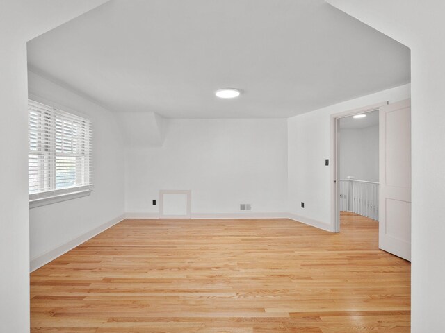 empty room with wood finished floors and baseboards