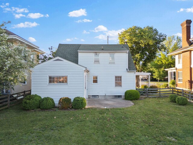 back of property featuring a patio area and roof with shingles