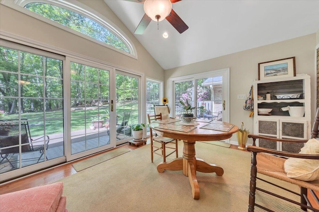 sunroom featuring vaulted ceiling and french doors