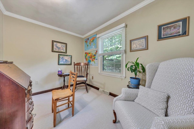 living area with baseboards, ornamental molding, and carpet flooring