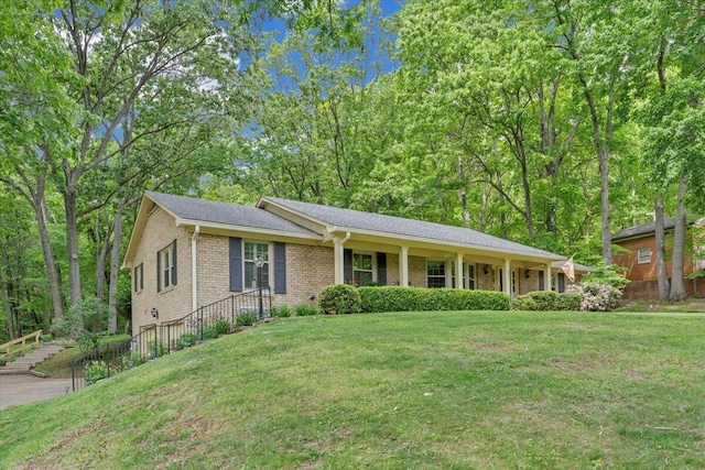 ranch-style home with a front lawn and brick siding