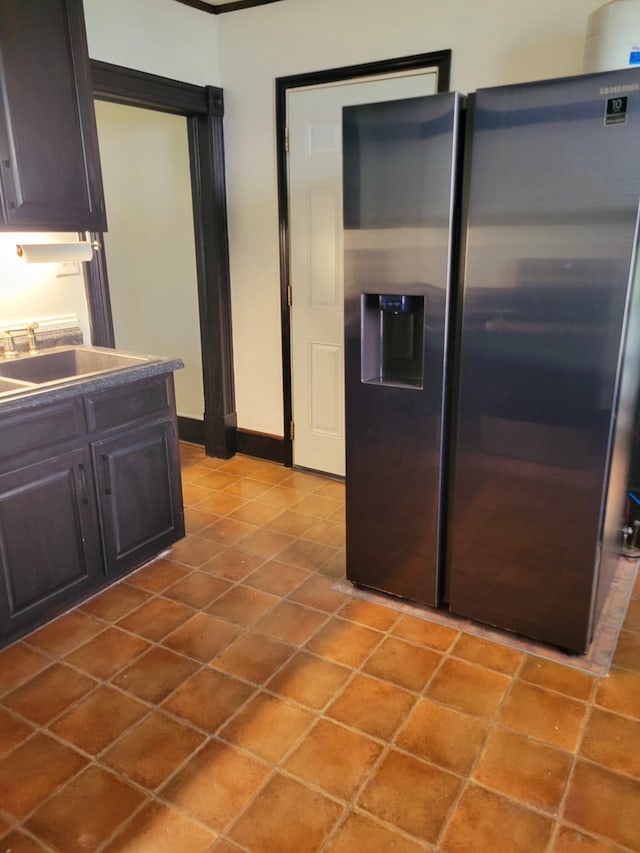 5159 Lee Hwy, Troutville, VA 24175 - kitchen with stainless steel fridge with ice dispenser, a sink, baseboards, tile patterned flooring, and dark brown cabinetry