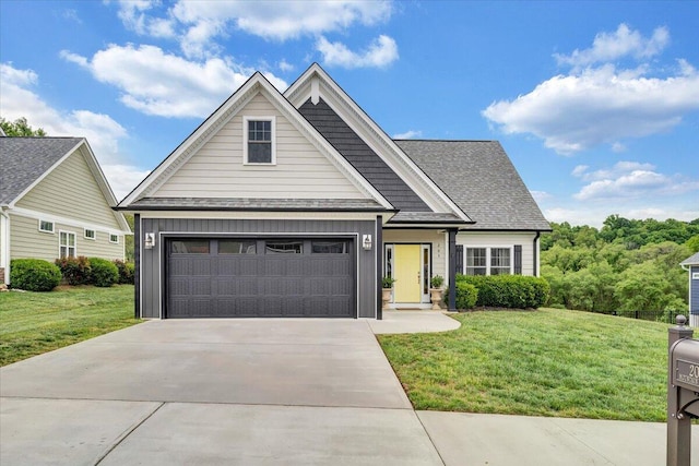 view of front of home with board and batten siding, a front lawn, concrete driveway, and roof with shingles