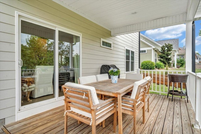 wooden deck with outdoor dining area