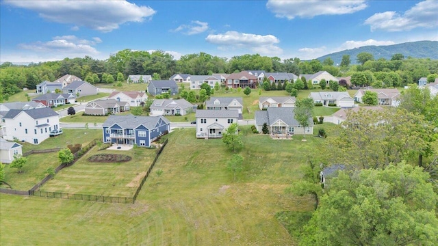 aerial perspective of suburban area featuring a mountain backdrop