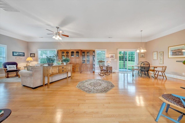 1119 Park Hall Rd, Huddleston, VA 24104 - living room with light wood-style flooring, a chandelier, ornamental molding, ceiling fan, and baseboards