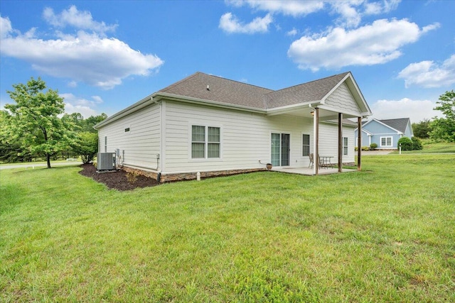 1119 Park Hall Rd, Huddleston, VA 24104 - back of property with a patio, a yard, cooling unit, and a shingled roof
