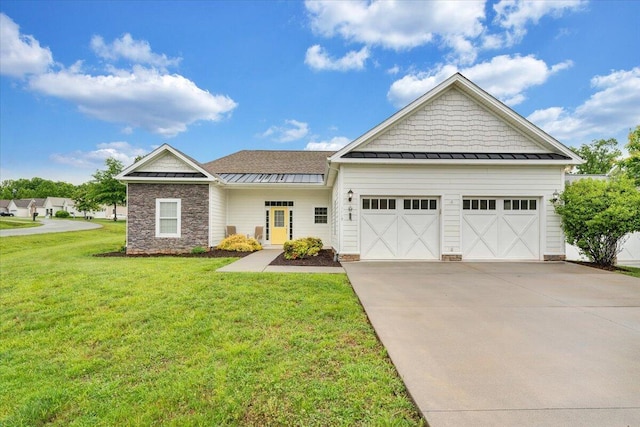 1119 Park Hall Rd, Huddleston, VA 24104 - craftsman inspired home with a standing seam roof, concrete driveway, a front lawn, an attached garage, and metal roof