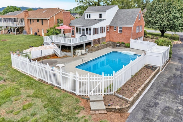 view of swimming pool featuring a wooden deck