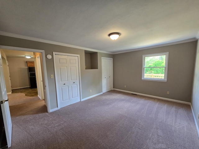 411 Raleigh Ave, Vinton, VA 24179 - unfurnished bedroom featuring carpet, crown molding, and baseboards