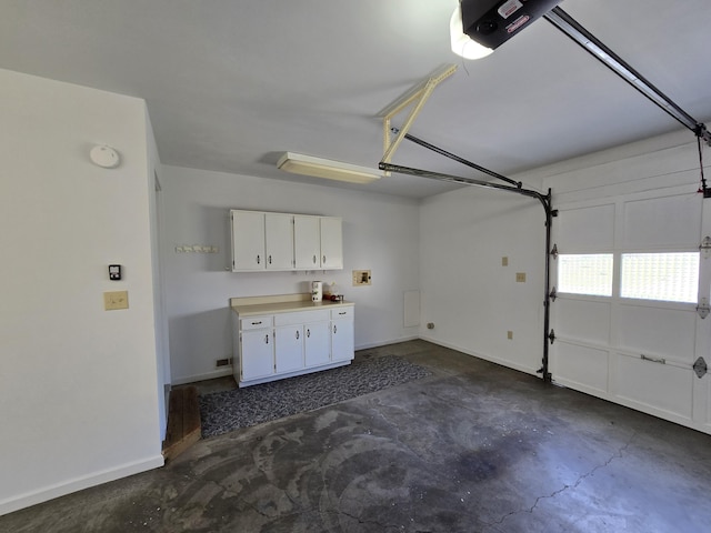 411 Raleigh Ave, Vinton, VA 24179 - garage with a garage door opener and baseboards