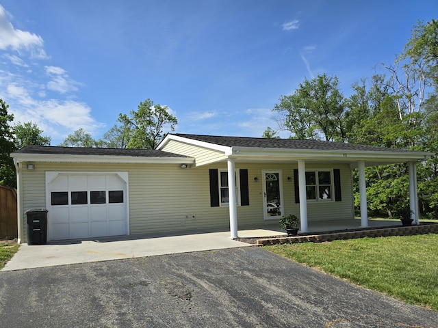 411 Raleigh Ave, Vinton, VA 24179 - view of front of property featuring a garage, driveway, and covered porch