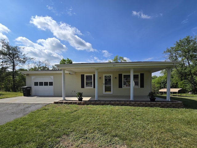 411 Raleigh Ave, Vinton, VA 24179 - view of front facade with an attached garage, asphalt driveway, covered porch, and a front yard