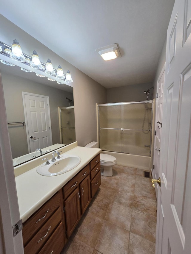 411 Raleigh Ave, Vinton, VA 24179 - full bathroom with vanity, toilet, and shower / bath combination with glass door