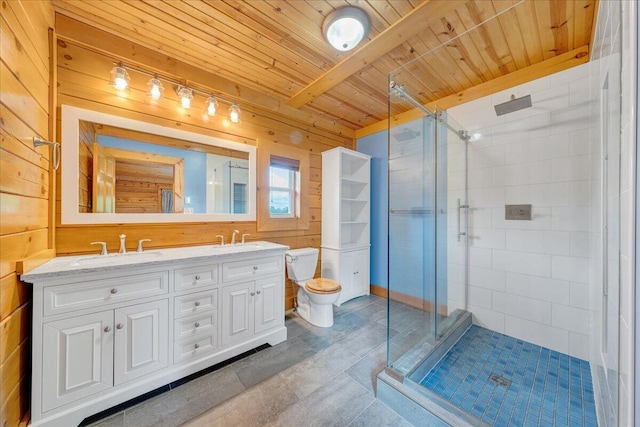 full bathroom featuring a shower stall, wooden ceiling, double vanity, toilet, and beamed ceiling