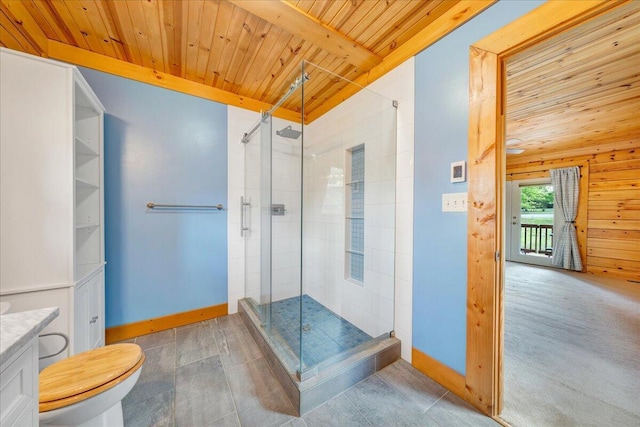 bathroom with wooden ceiling, a stall shower, baseboards, toilet, and vanity
