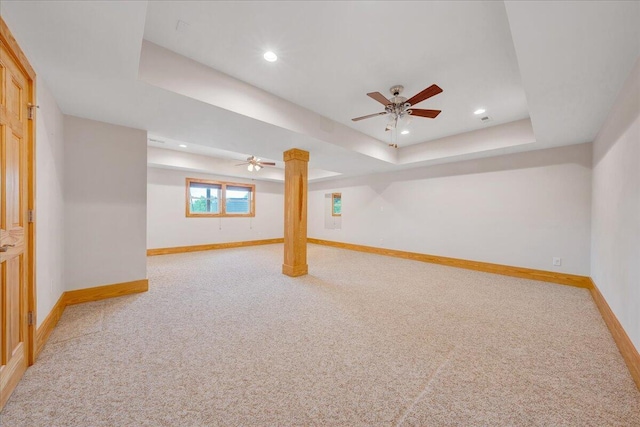 below grade area with light colored carpet, baseboards, a ceiling fan, and recessed lighting
