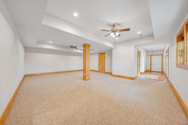 finished below grade area featuring light carpet, baseboards, recessed lighting, and ceiling fan