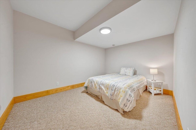 carpeted bedroom featuring baseboards