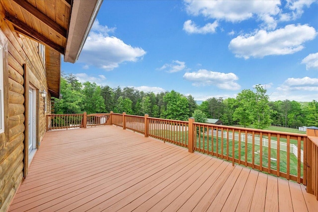 wooden deck with a yard
